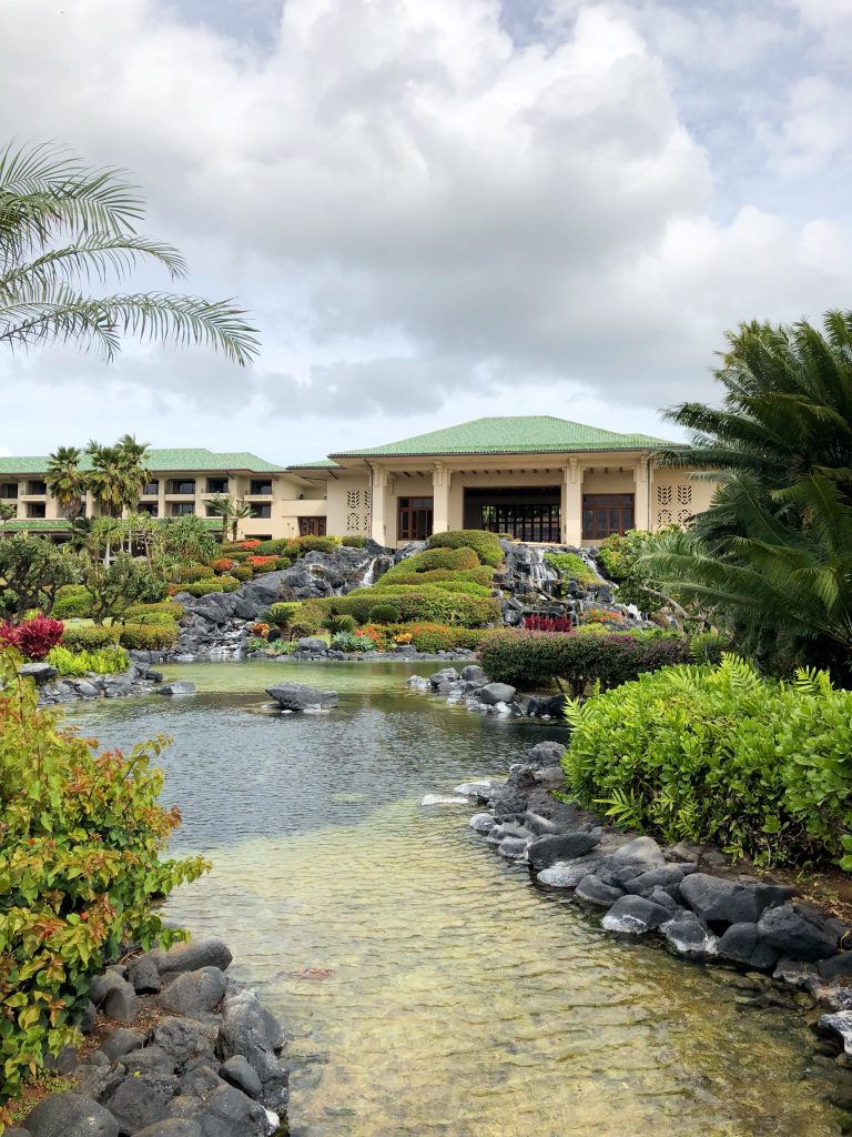 back of the Grand Hyatt hotel in Kauai. Small waterfall and pond.