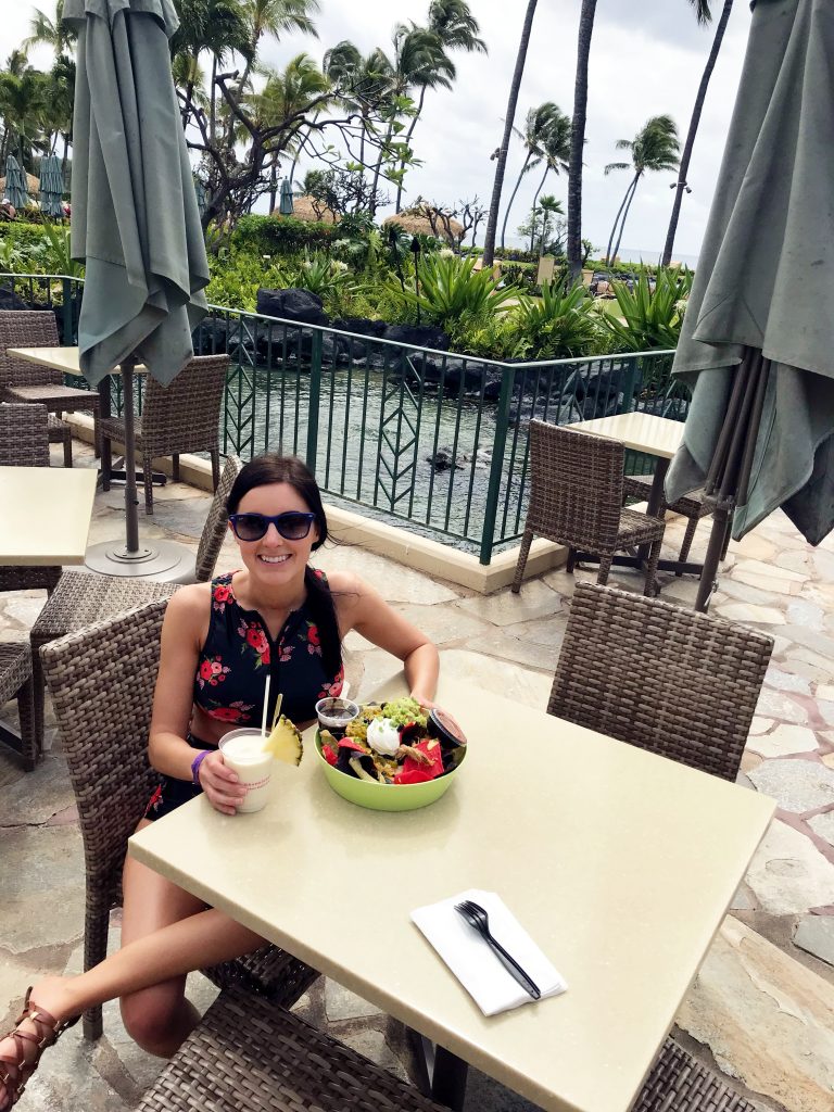 eating pork nachos at Grand Hyatt Kauai