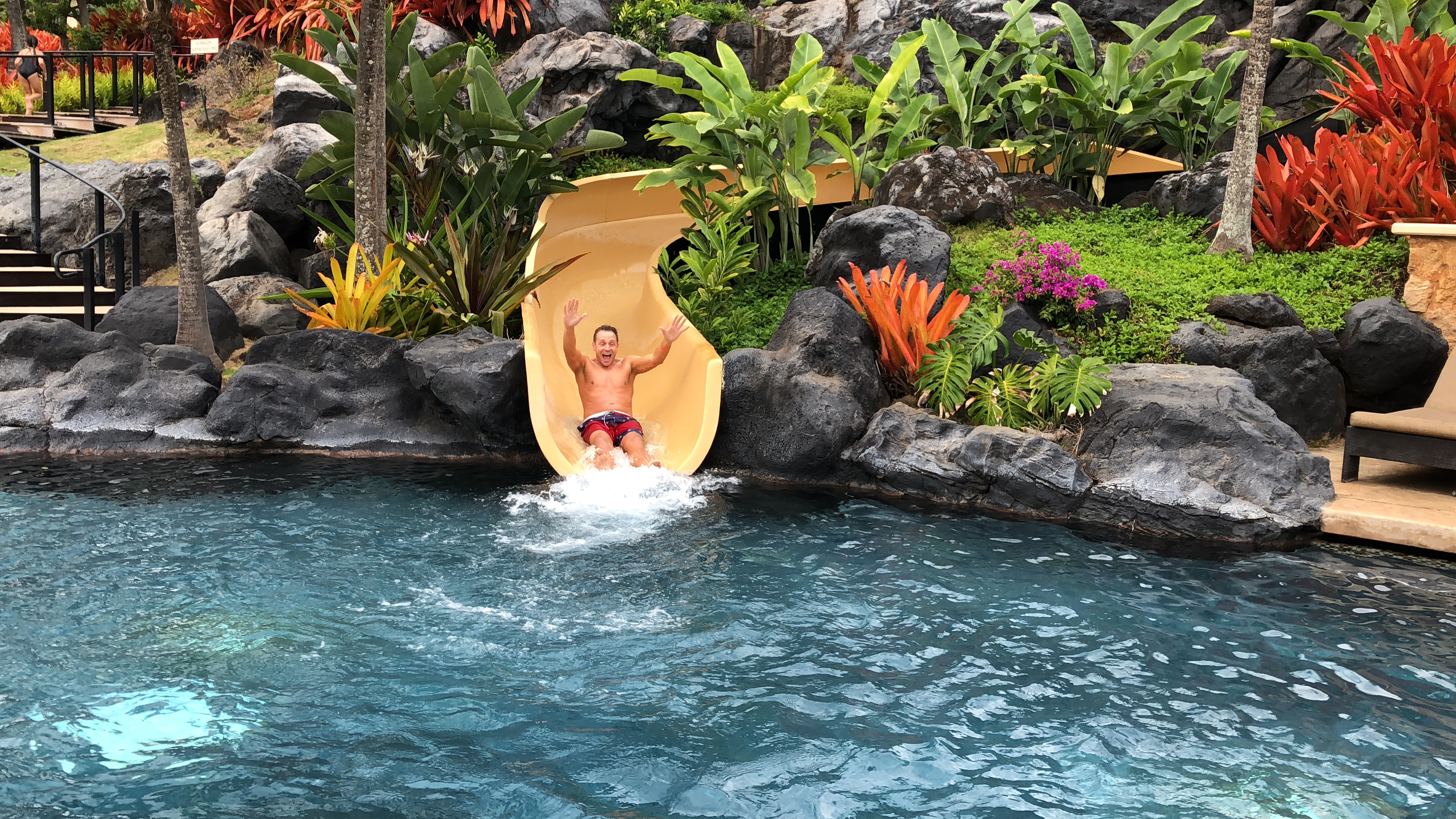 man going down waterslide at the Grand Hyatt Kauai