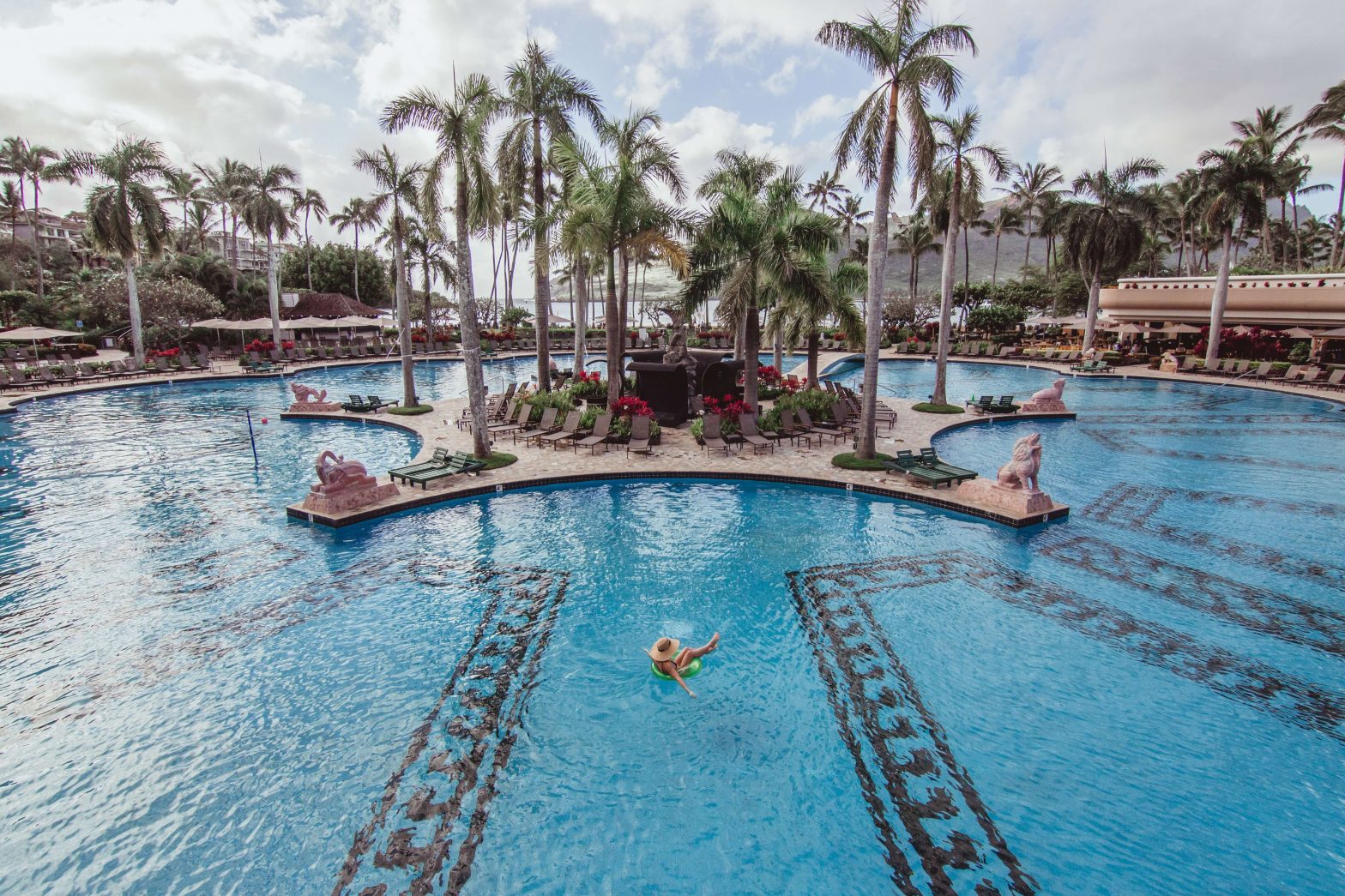 woman swimming in pool at kauai resort