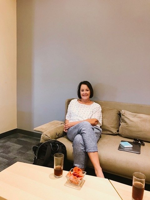 woman sitting in priority pass lounge in puerto vallarta