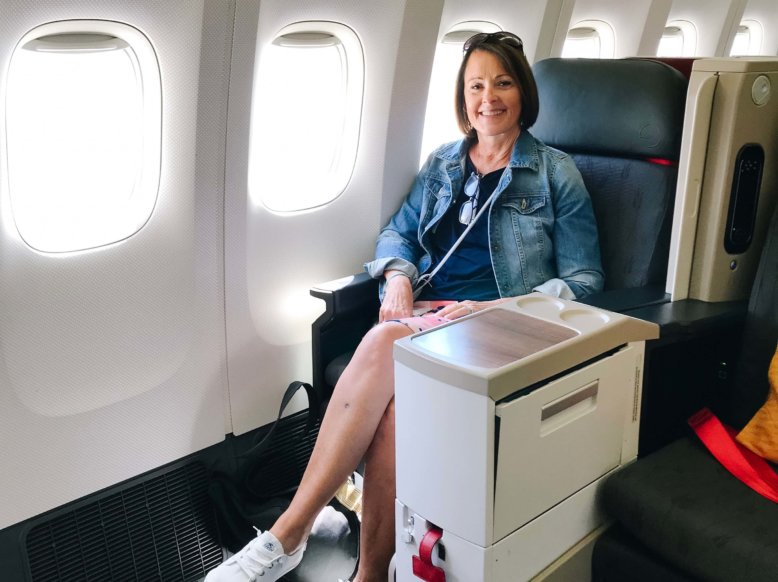Woman sitting in business class seat on Turkish Airline