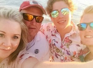 a family in maui at the beach