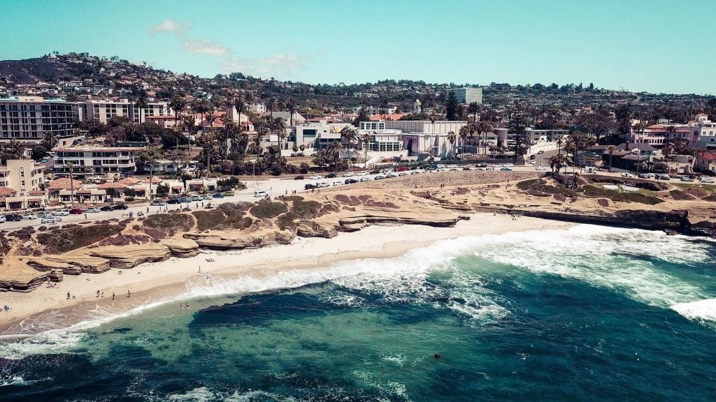 Beach, ocean and buildings in background