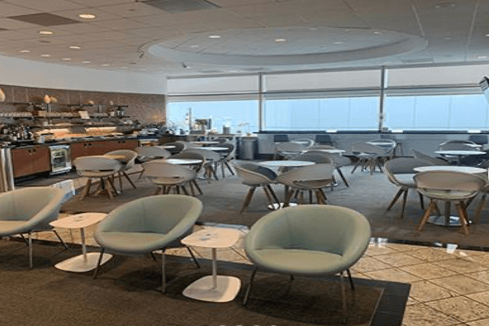 Table and chairs with view of airport tarmac