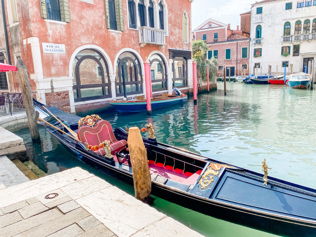 long skinny boat on canal