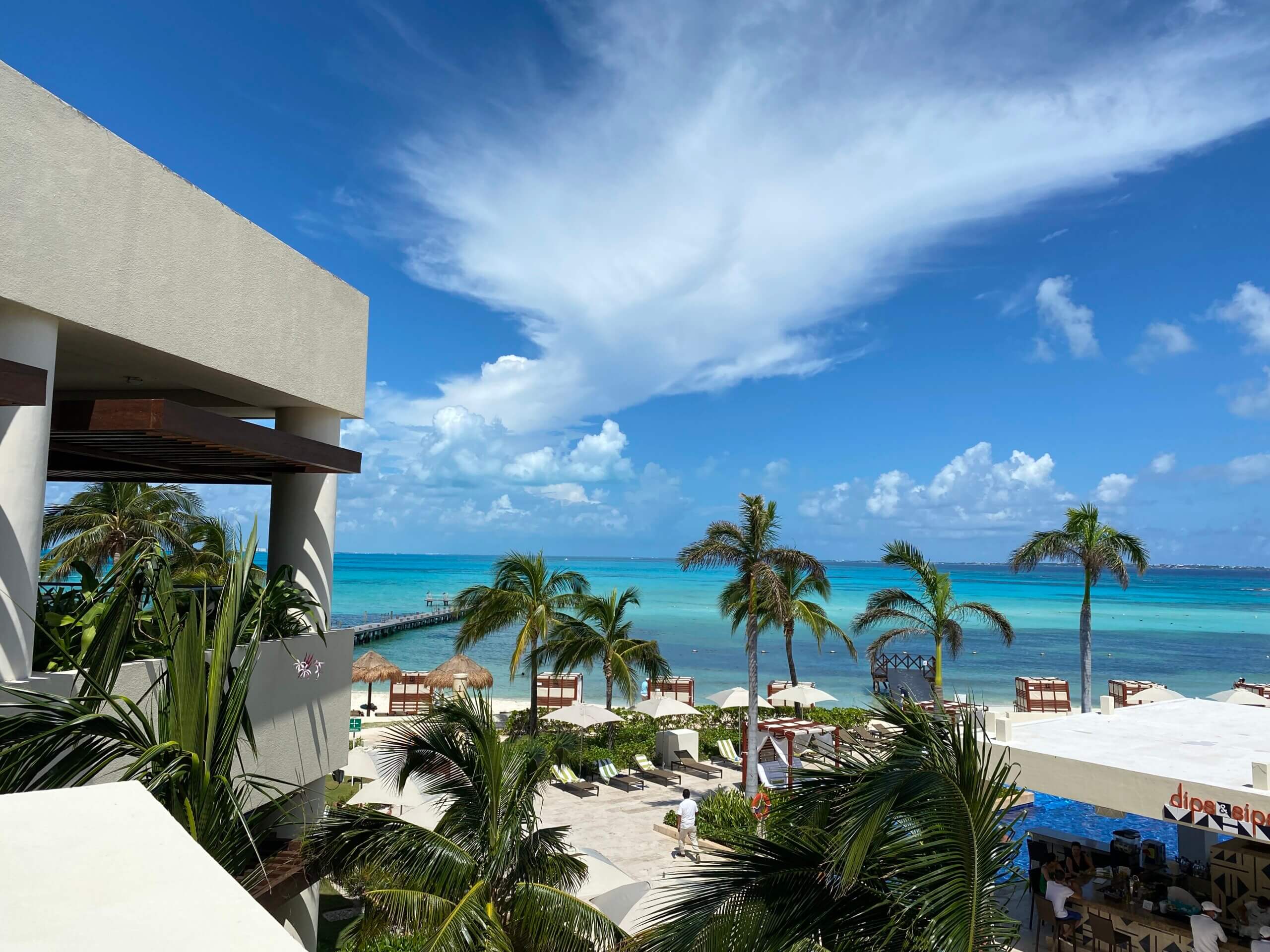 Hotel, palm trees and ocean