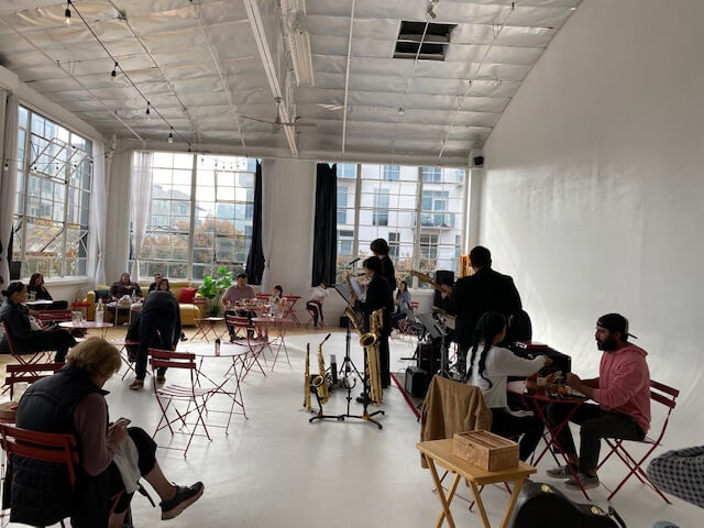 People sitting at red tables