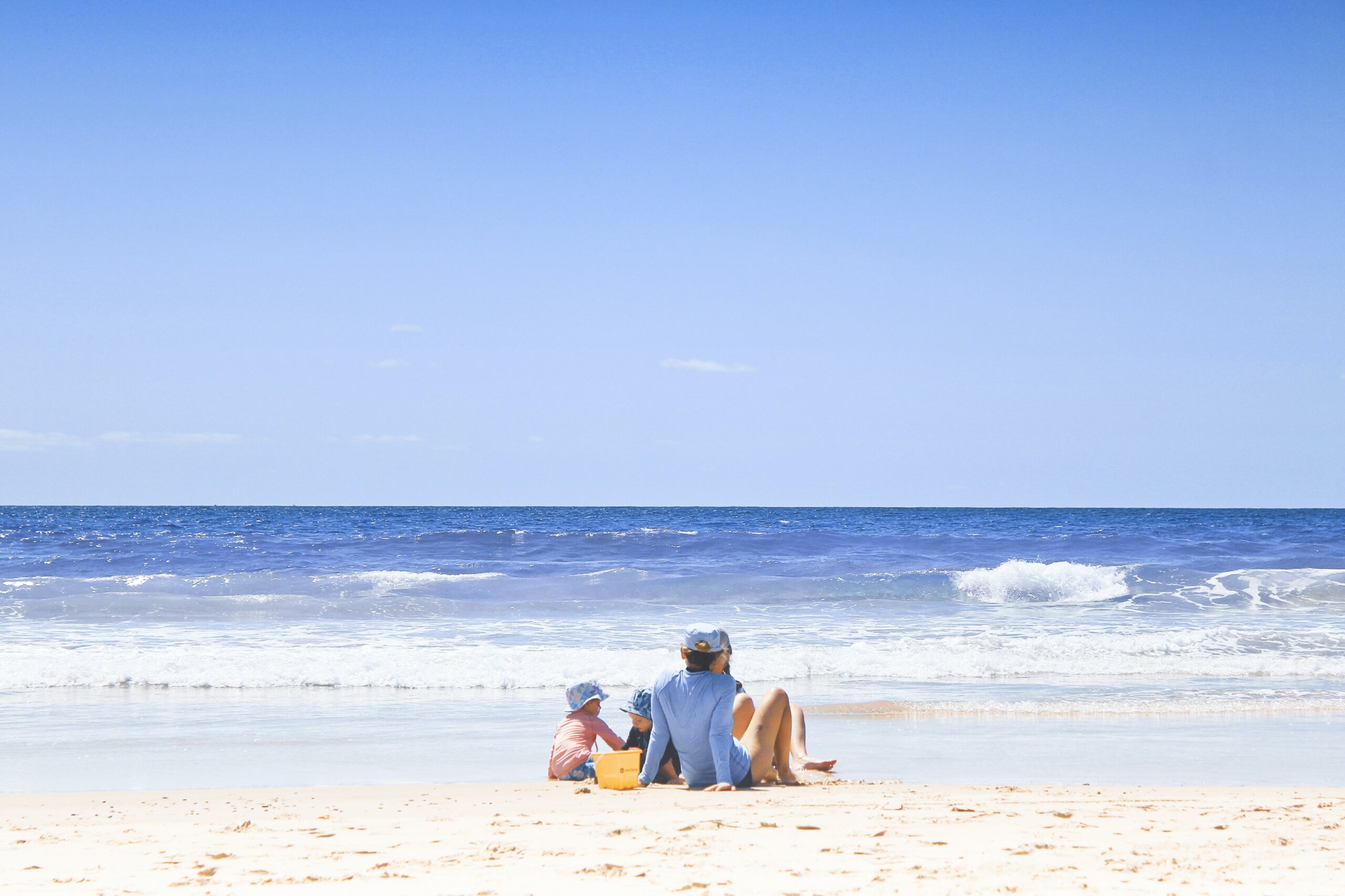 Family sitting on a beach
