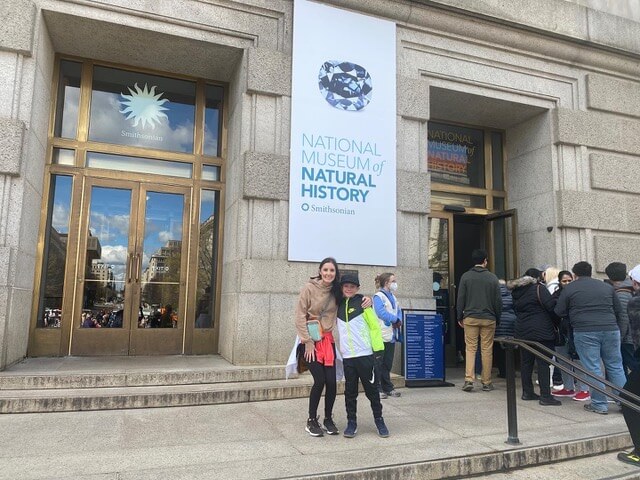 woman and boy standing outside museum