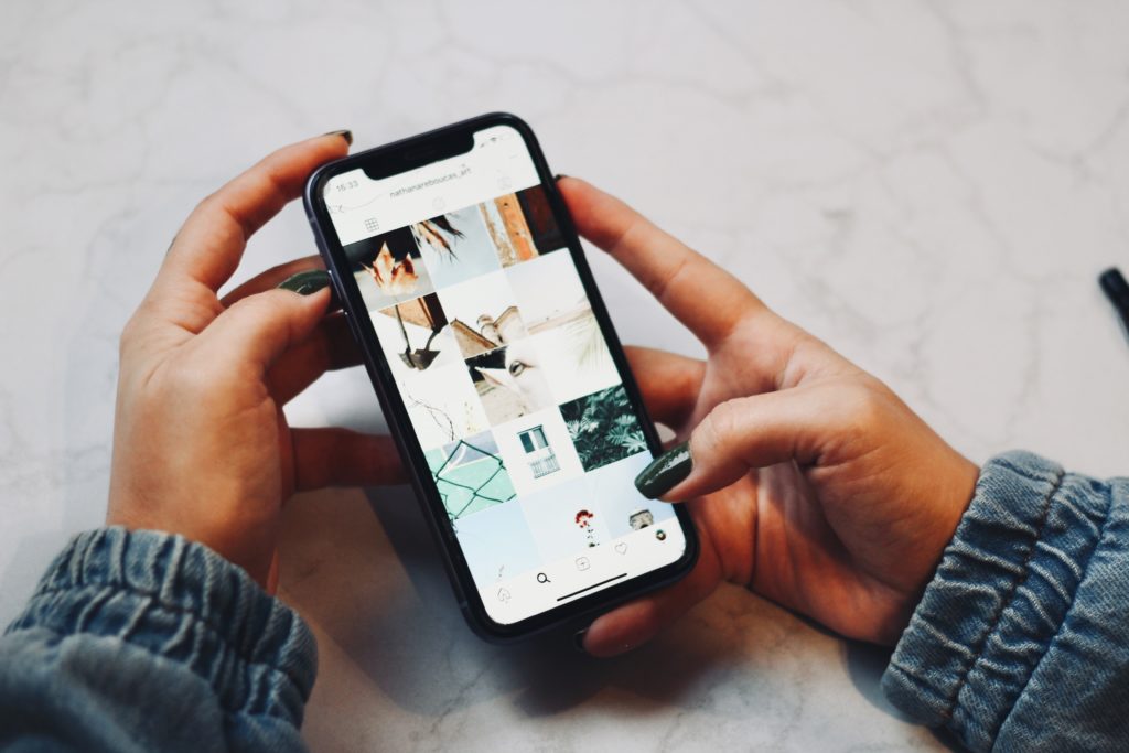 hands holding cell phone