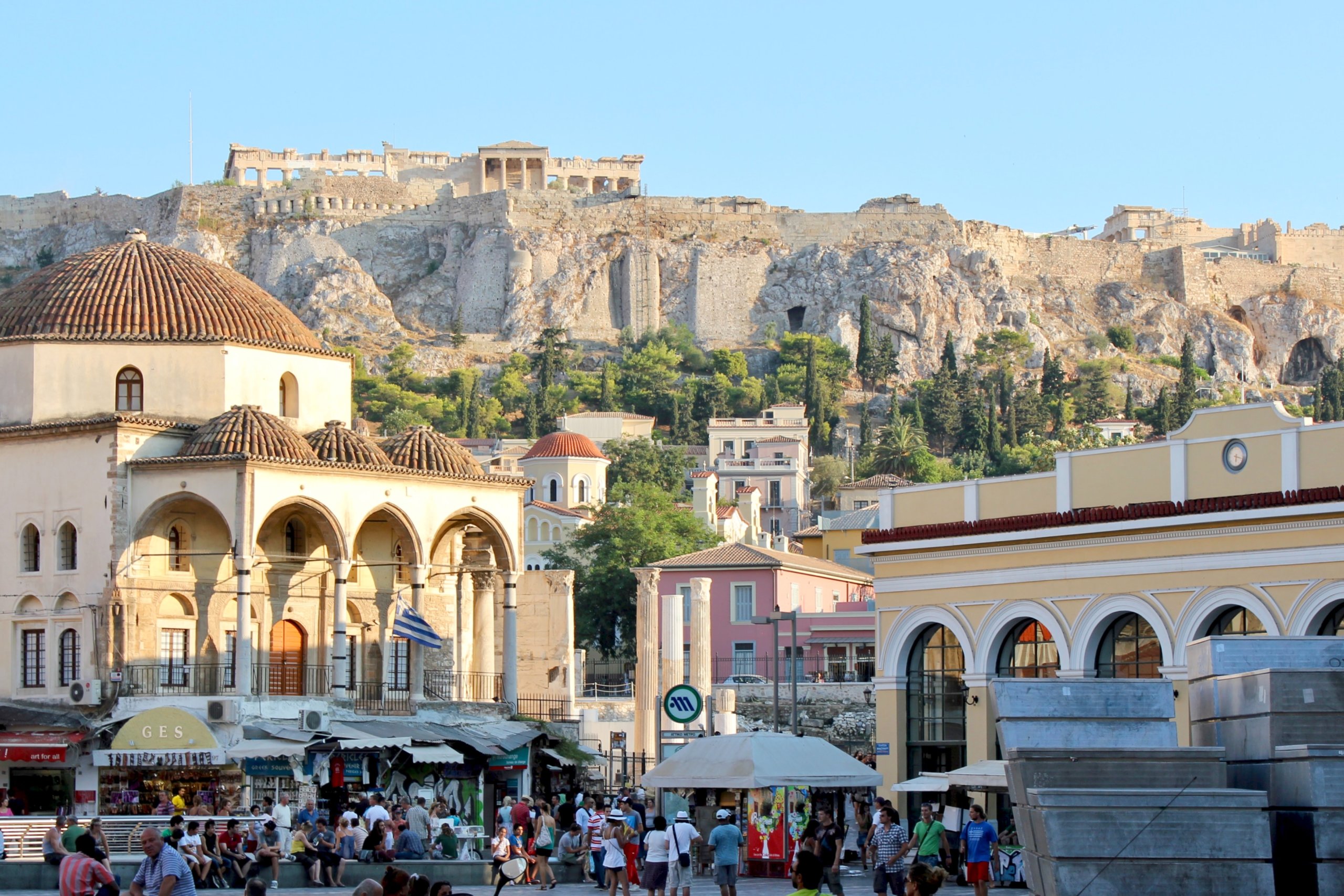 Old building on top of mountain with pillars and buildings below