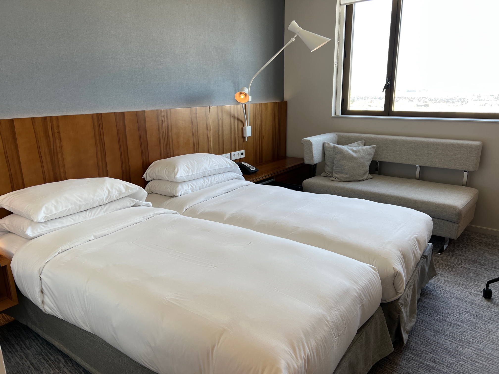 hotel room with two white queen beds