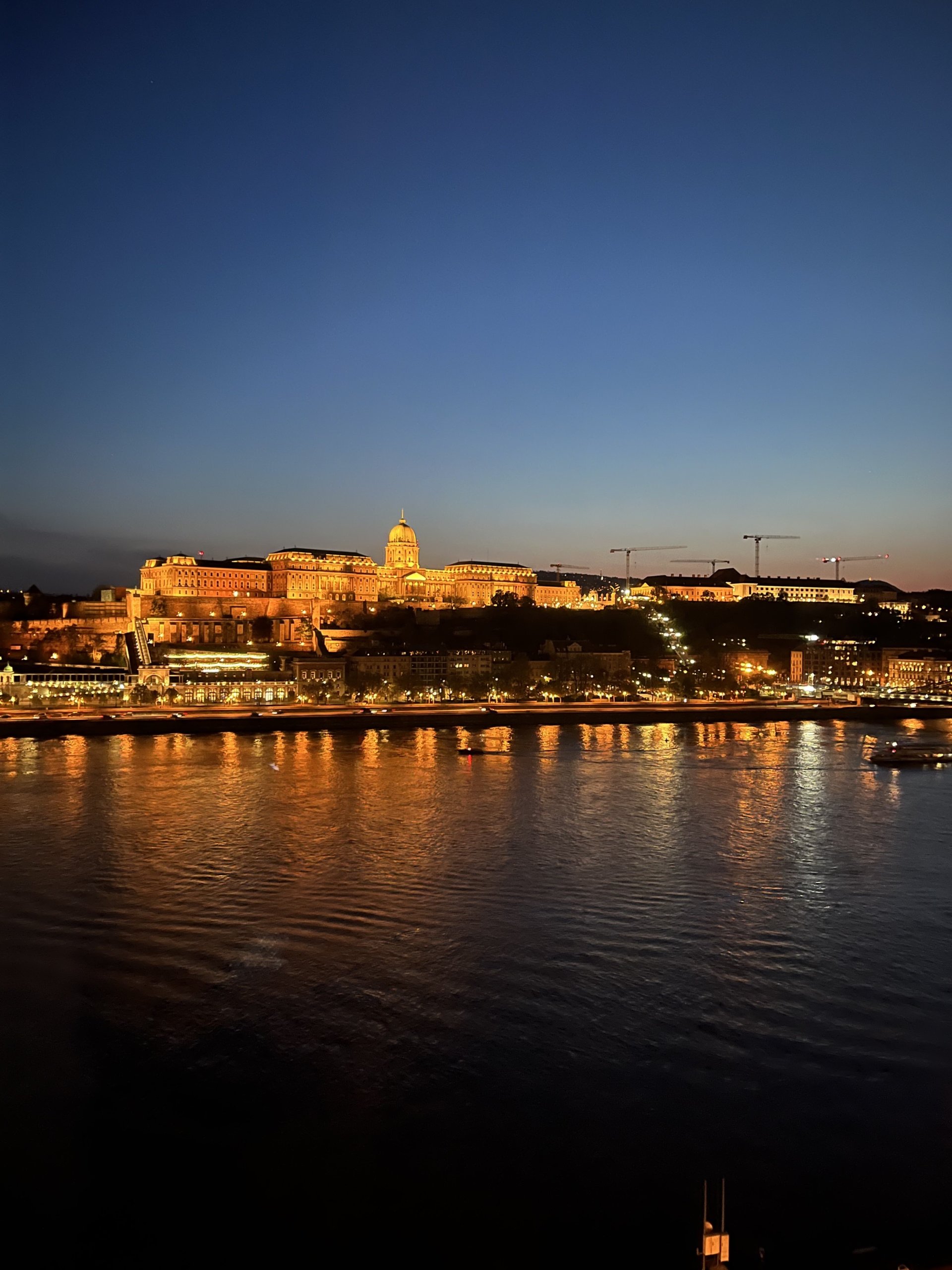 Castle at night by water
