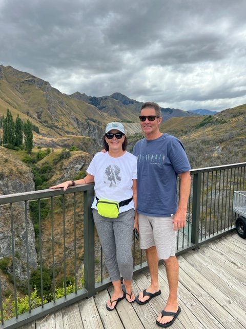 Man and woman standing in front of canyon