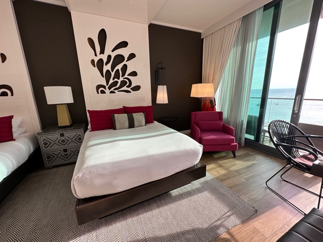 Hotel room with bright pink accents