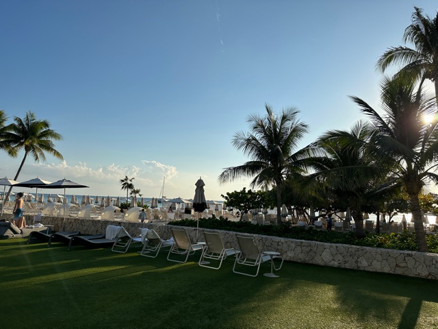 White lounge chairs near beach