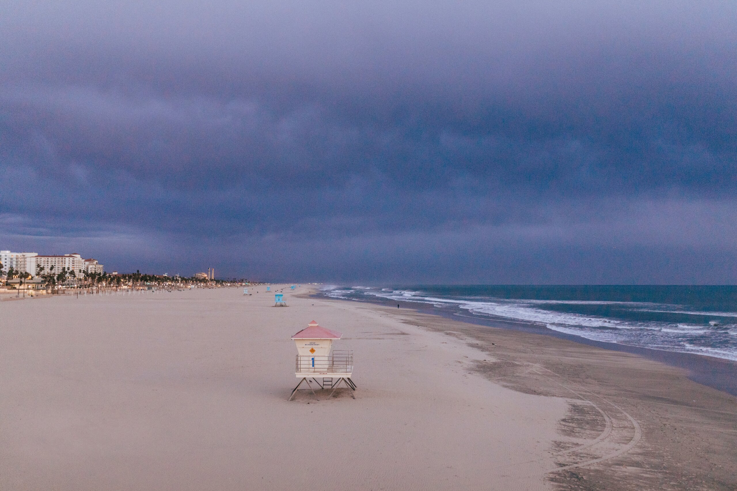 Sand and ocean with lifeguard station