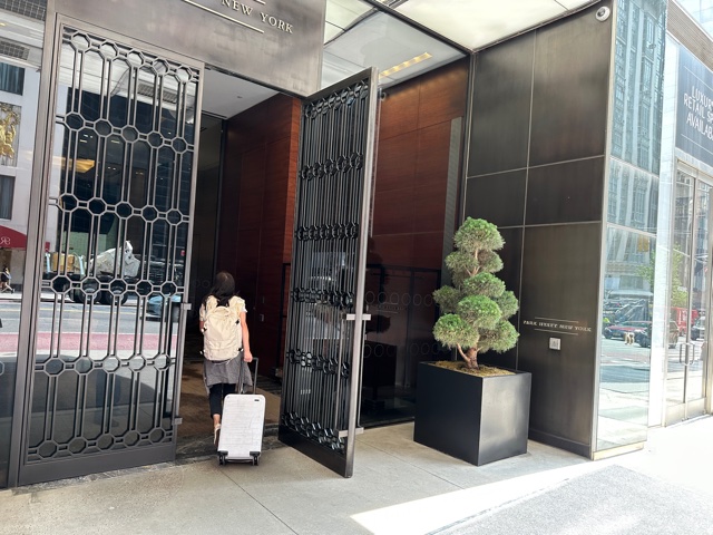 Girl walking into hotel front door