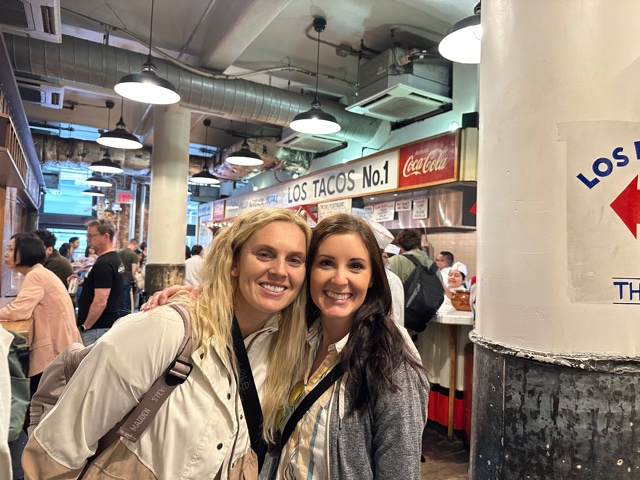 Two girls in front of Los Tacos No. 1