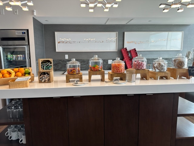 Jars of candy on shelf.