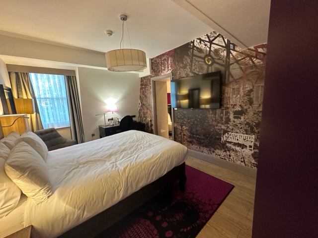 Hotel room with purple and black colors