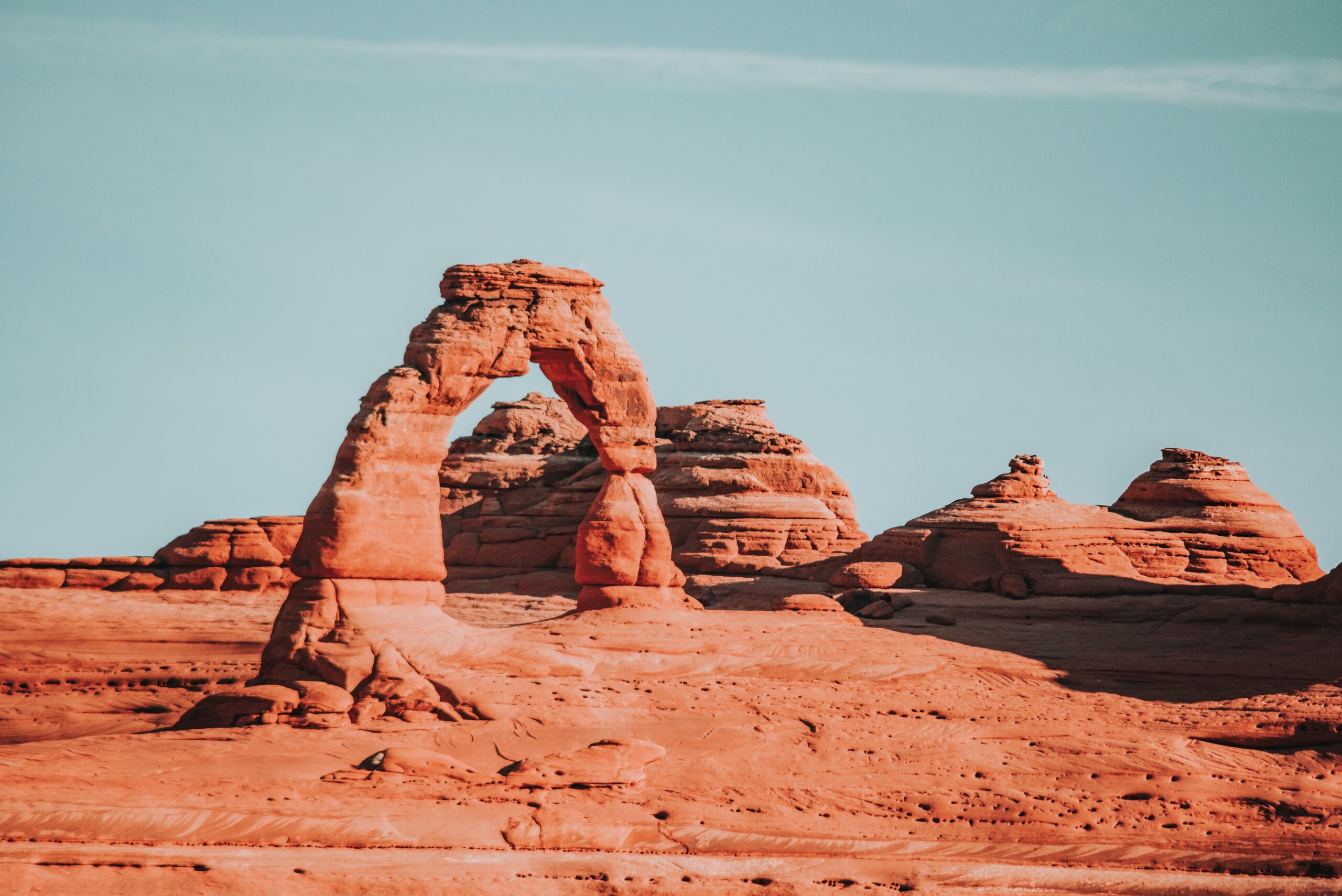 Red rock arch and mountains
