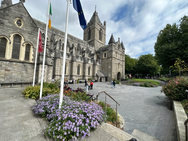 Grey. church with purple flowers