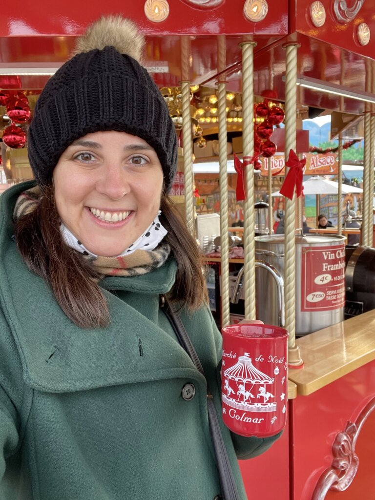 Woman with coffee near Christmas Market