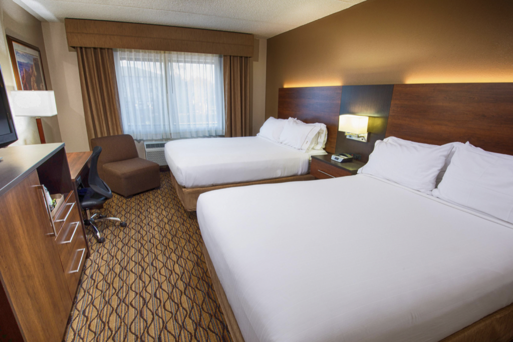 Friday Family Vacation: Grand Canyon - Hotel room with two white covered beds and brown carpet