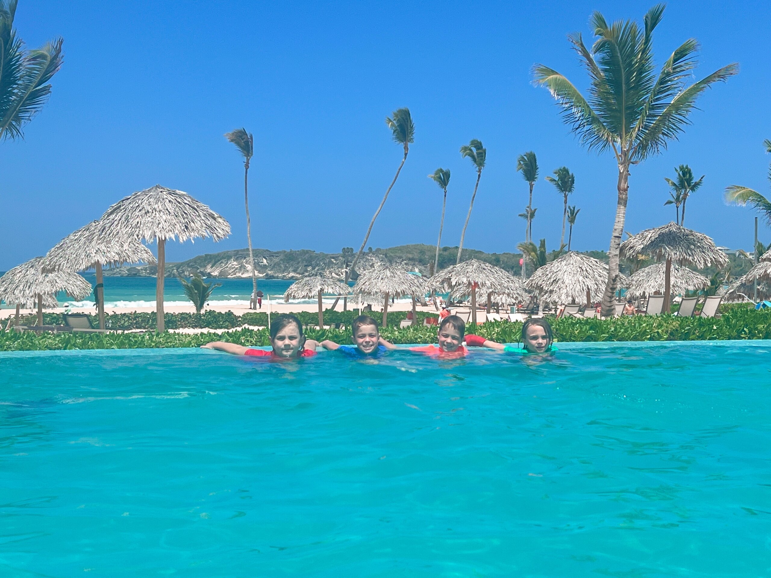 Four boys in swimming pool