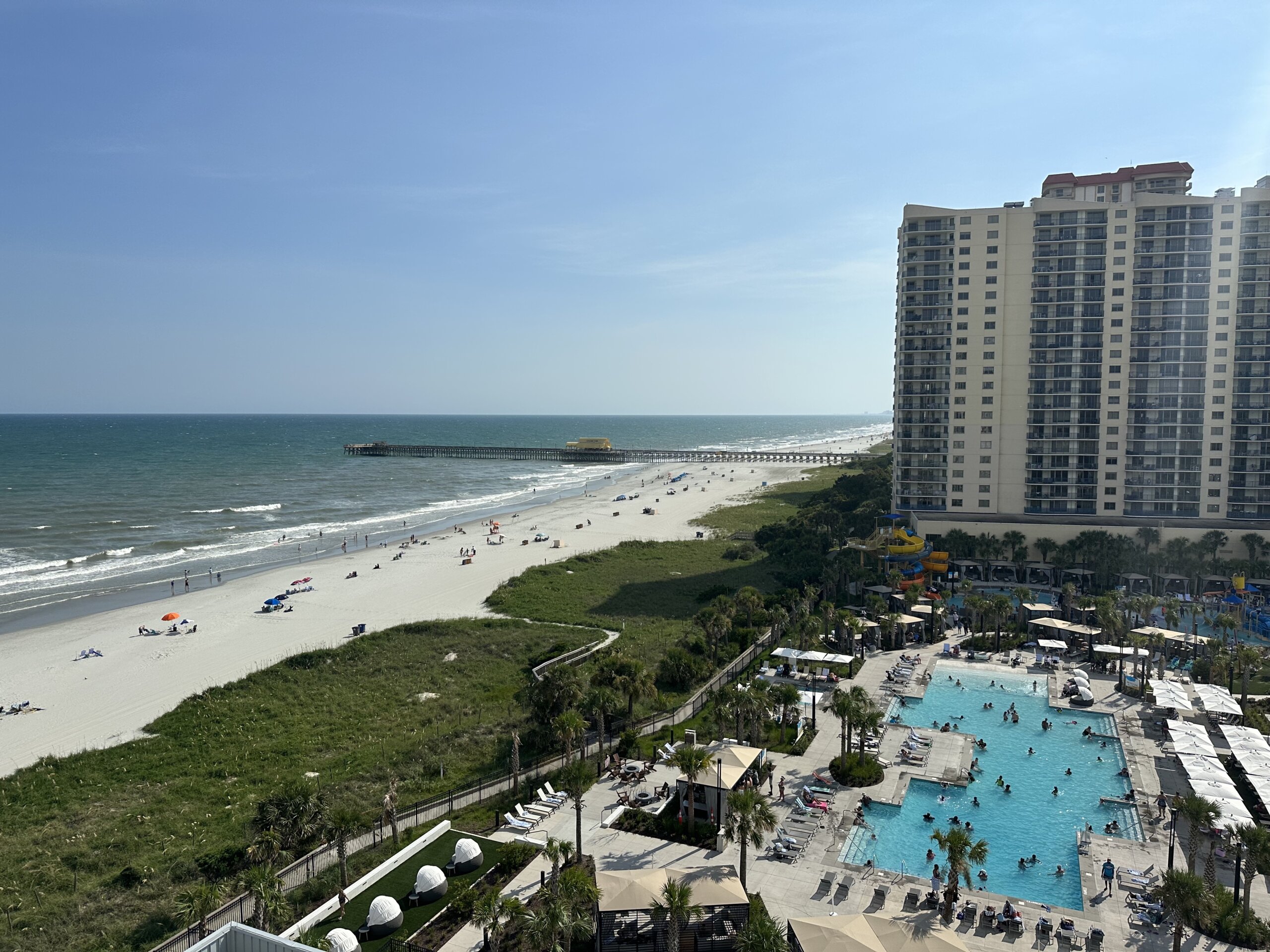 High rise hotel on beach with pool