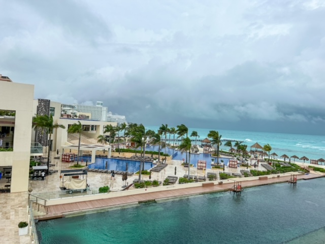 Cloudy view of resort with pools