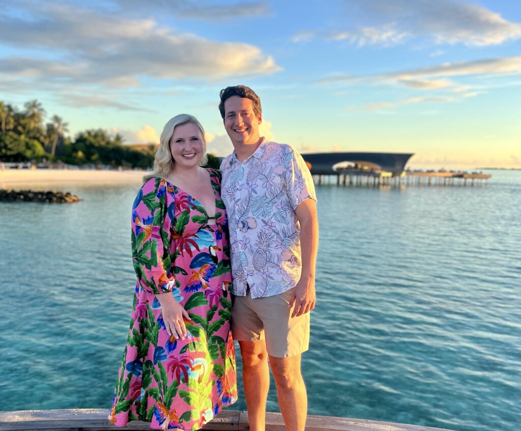 Man and woman standing near water