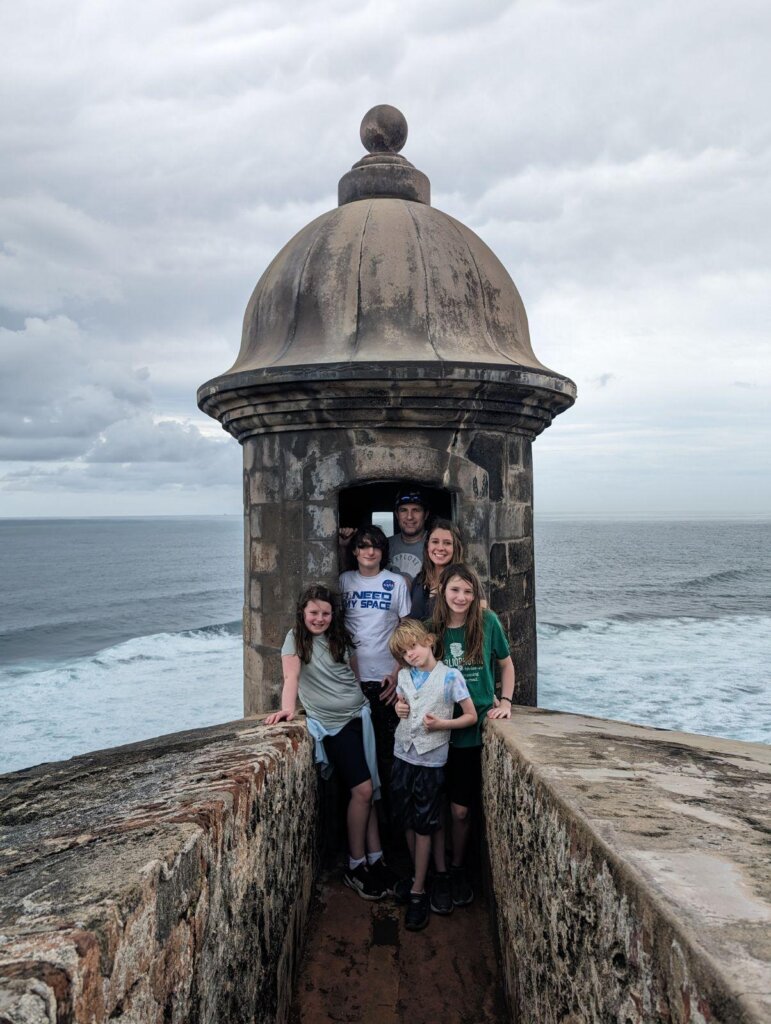 Family standing on old fort