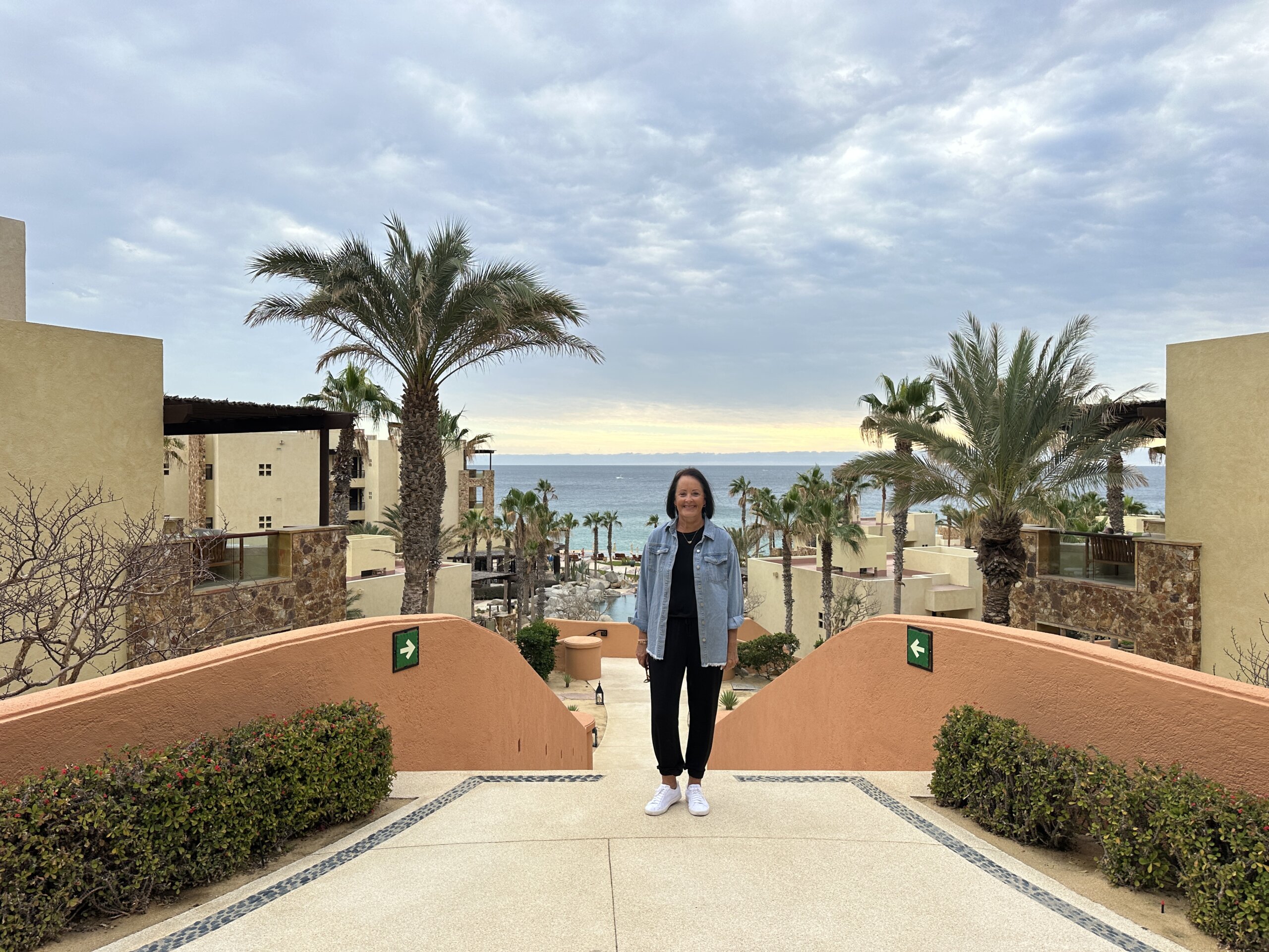 Woman standing on hotel steps