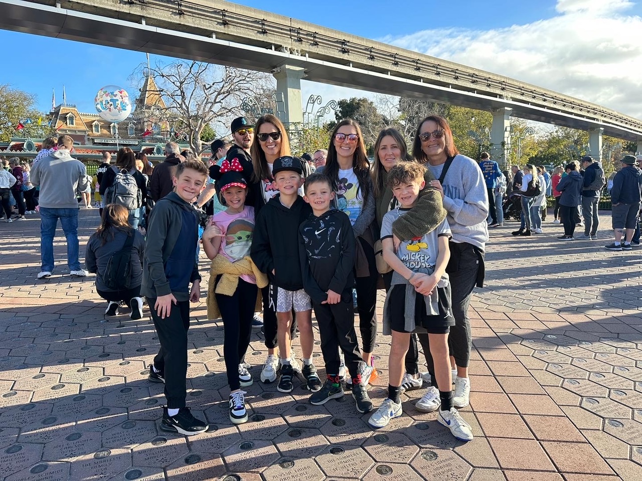 Large group standing in front of amusement park