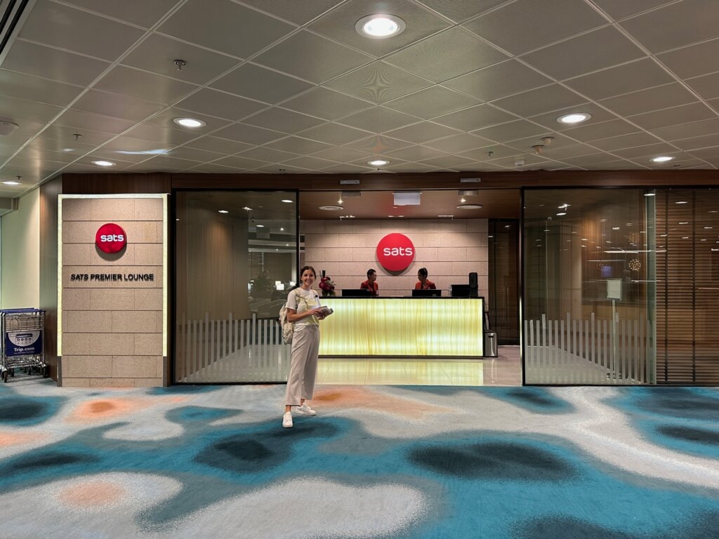 Girl standing outside airport lounge