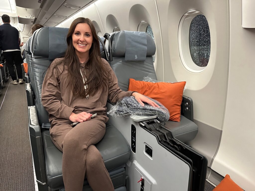 Woman sitting in airplane seat