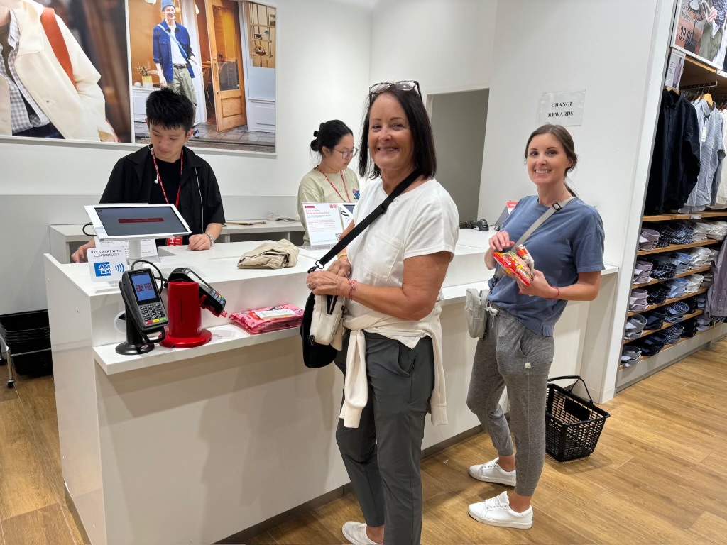 Two women buying clothes