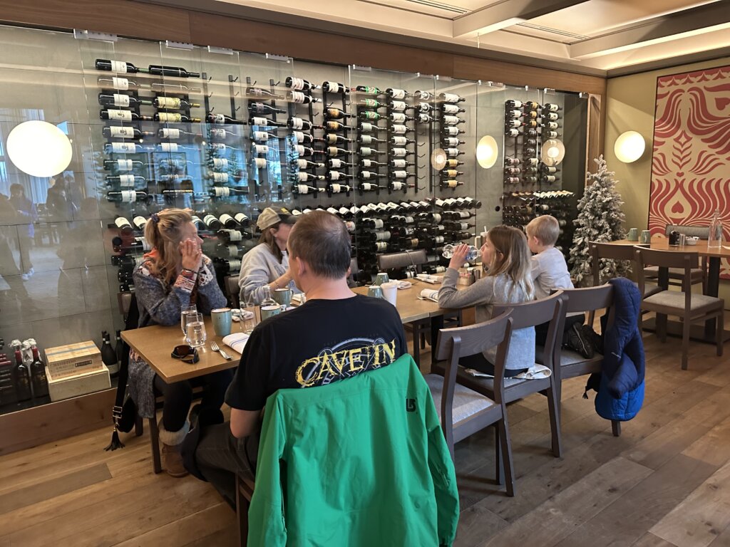 Family eating in wine room