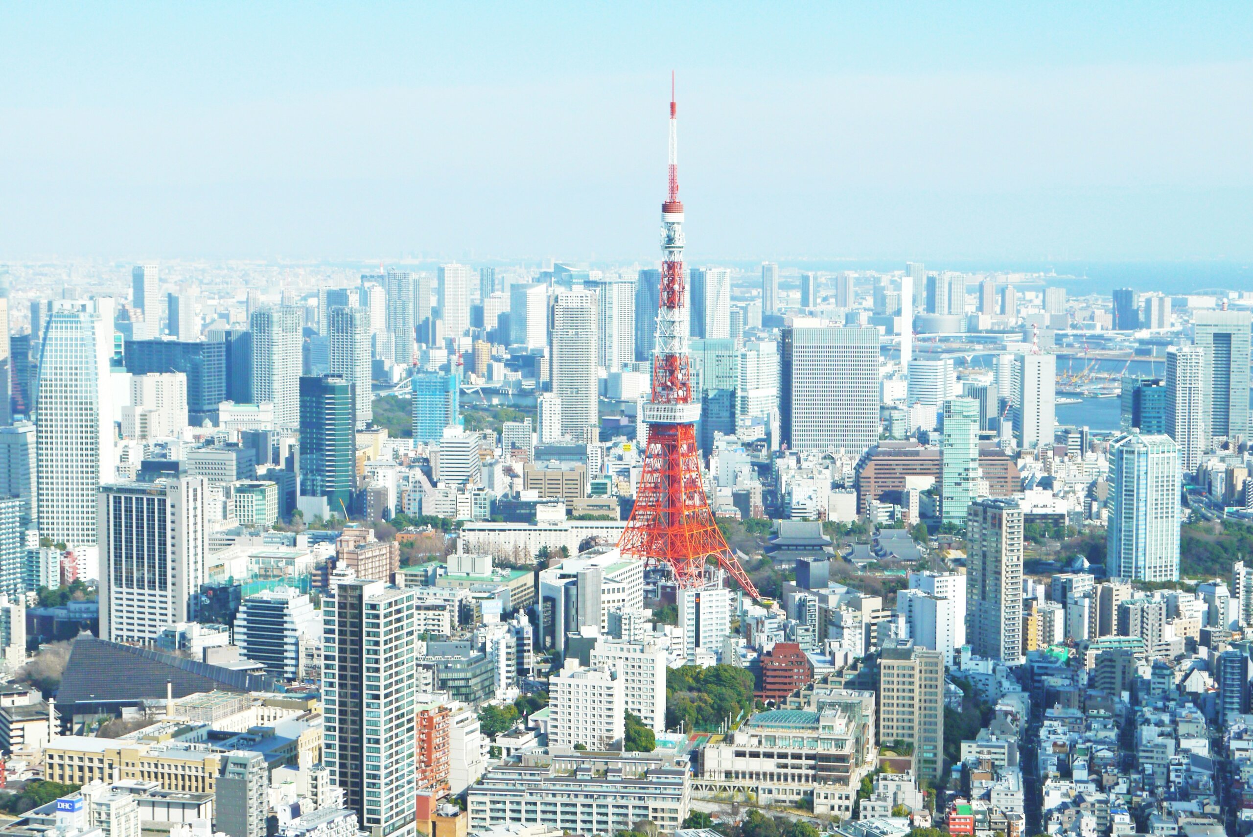 Aerial view of city with red tower in middle