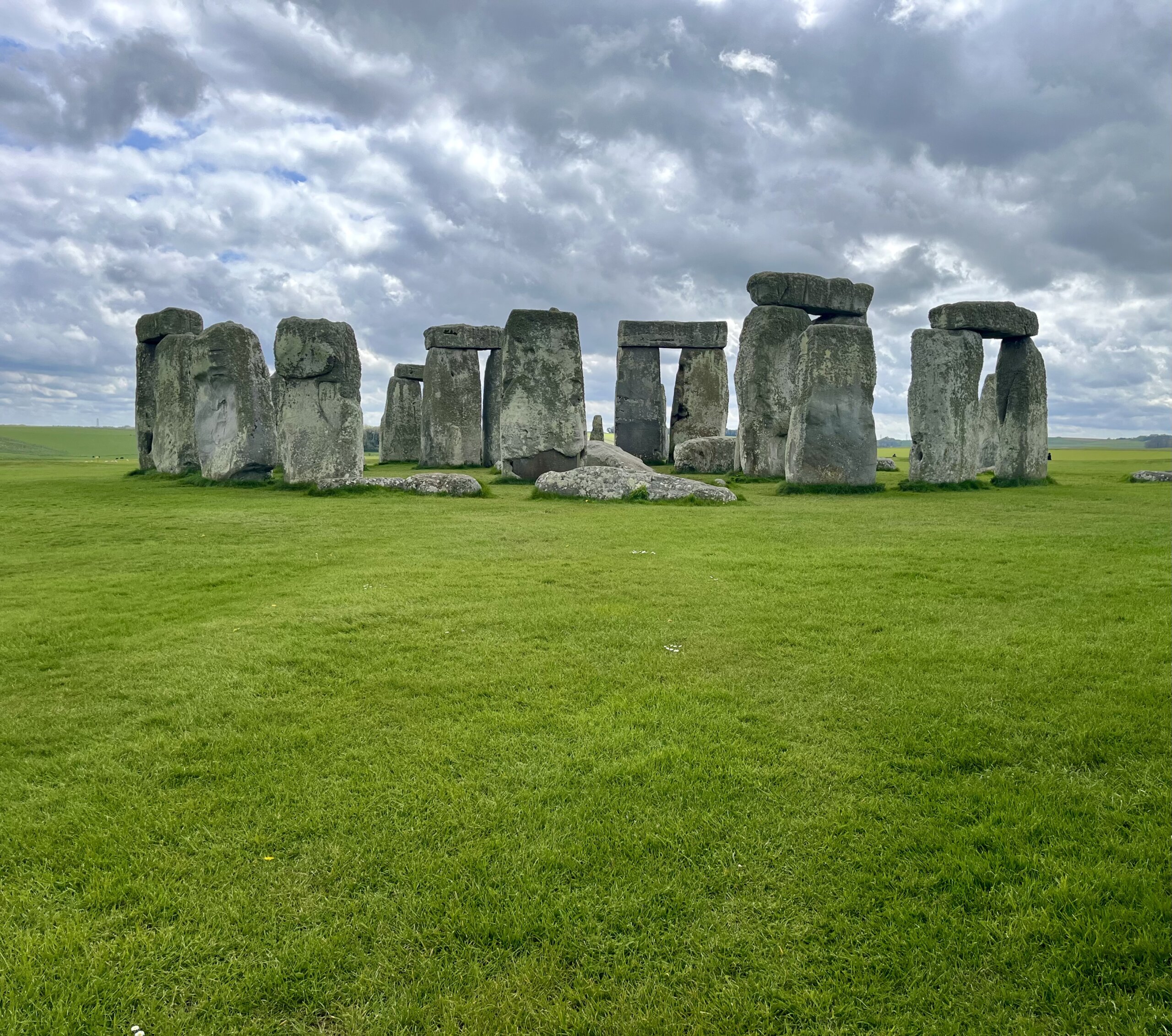 Green field with large stones standing up on it