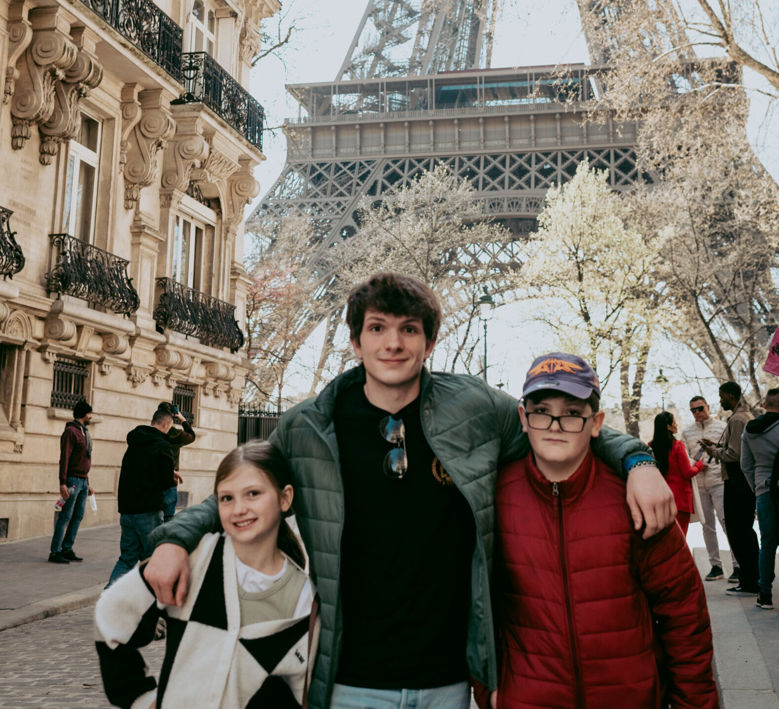 Family in front of the Eiffel Tower