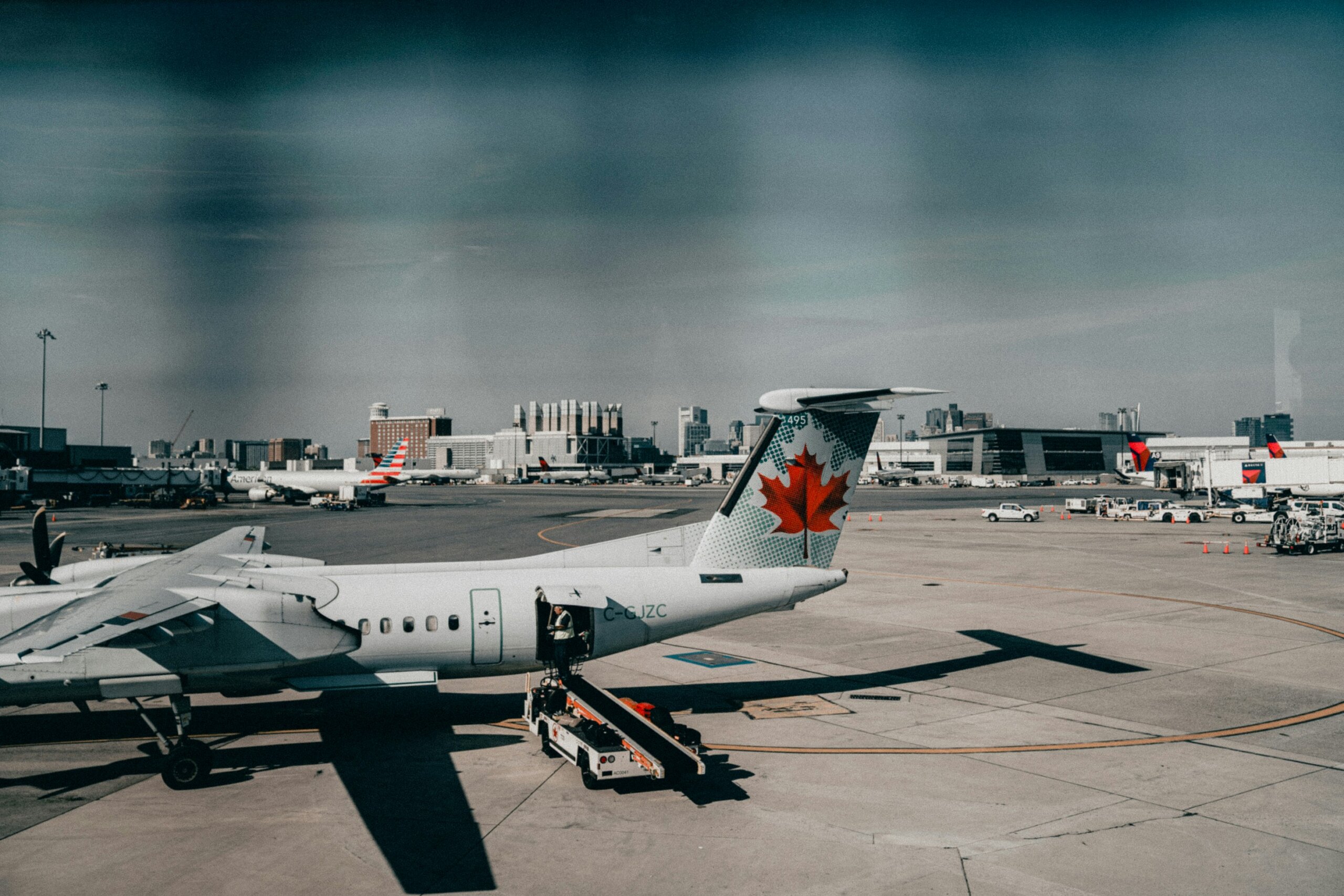 Air Canada airplane parked at an airport gate.