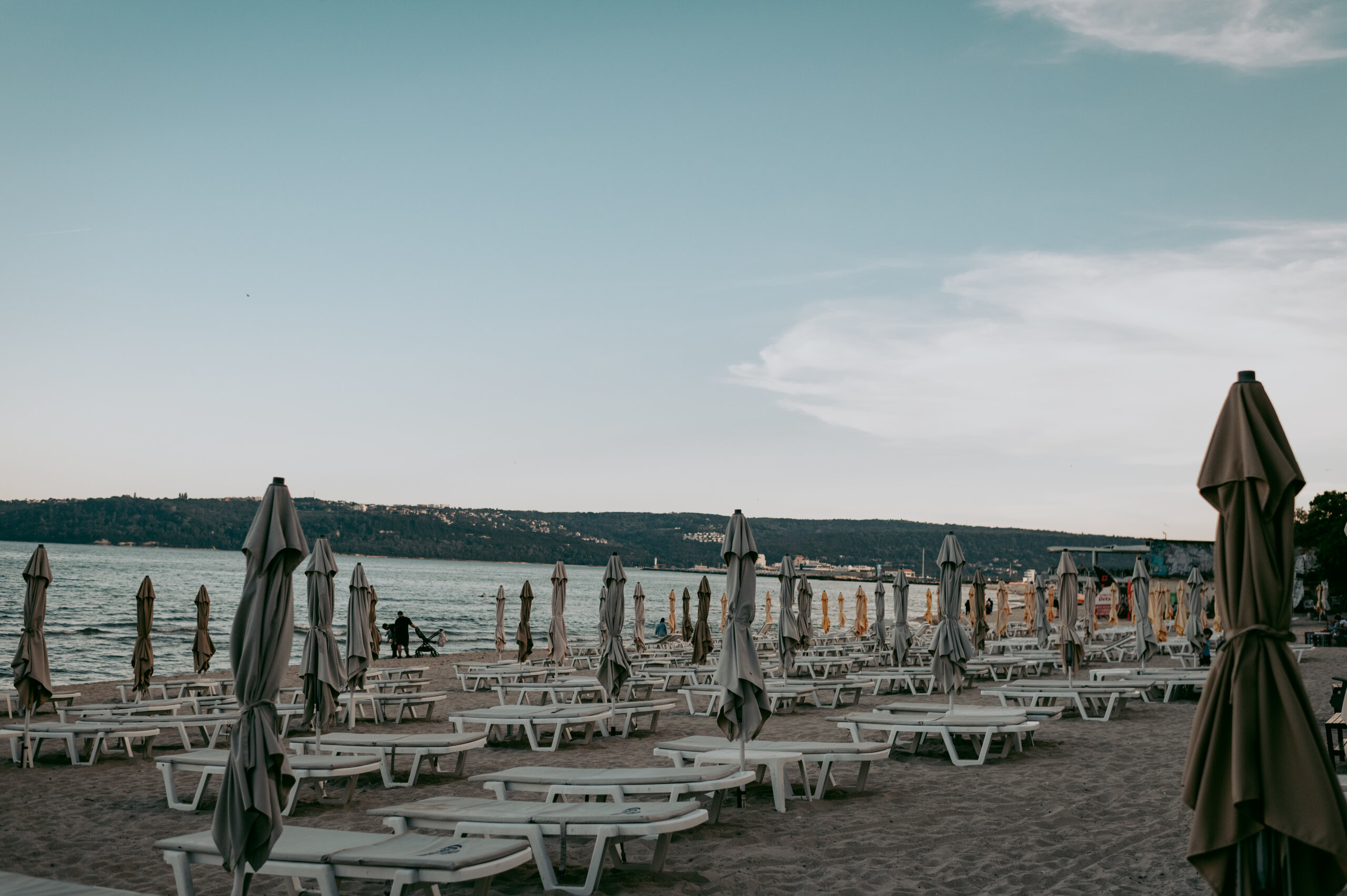 Beach chairs lined across the shore of the Black Sea