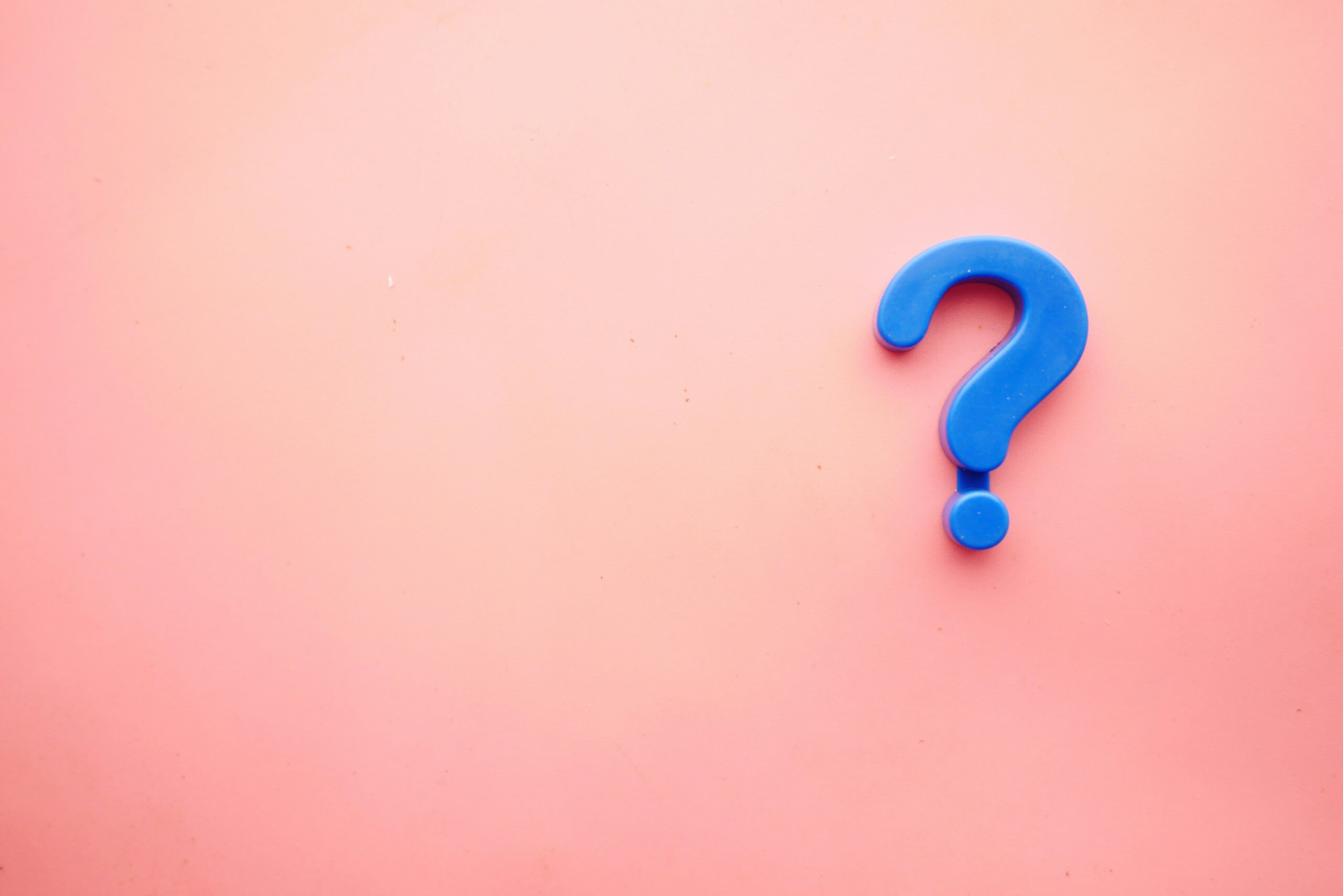 Pink background with blue exclamation point on the right