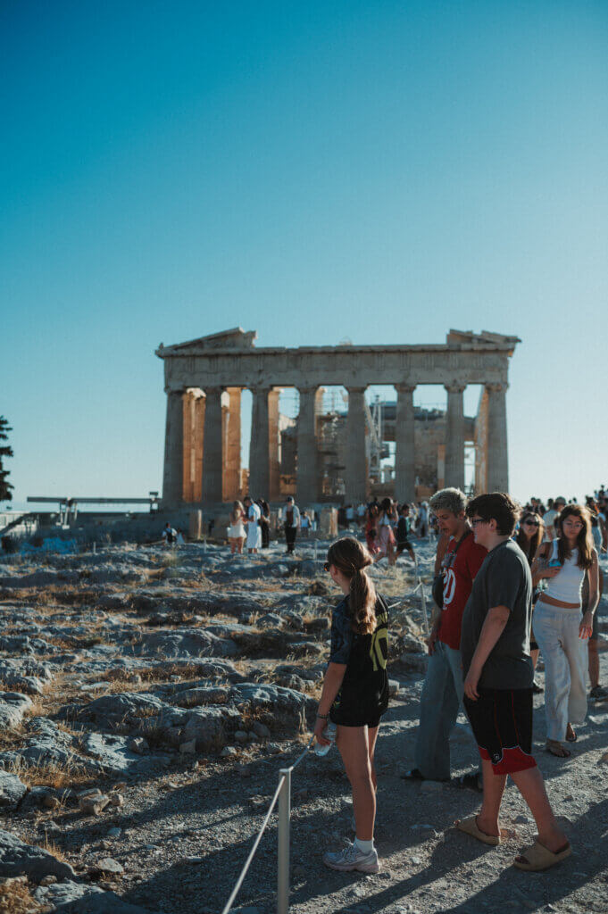 Kids looking out over the Parthenon in Athens