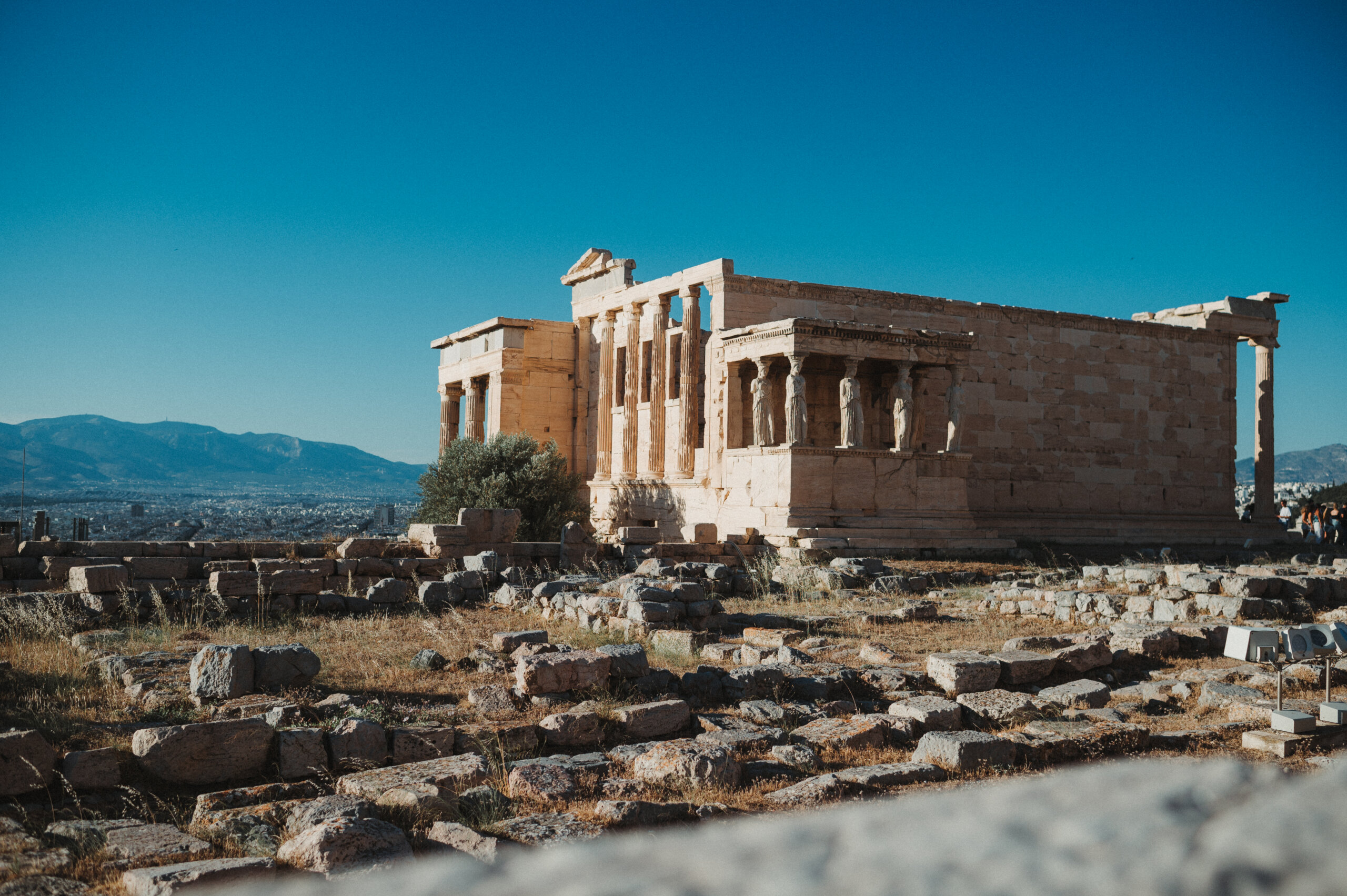 The Parthenon in Athens in front of a deep blue, cloudless sky