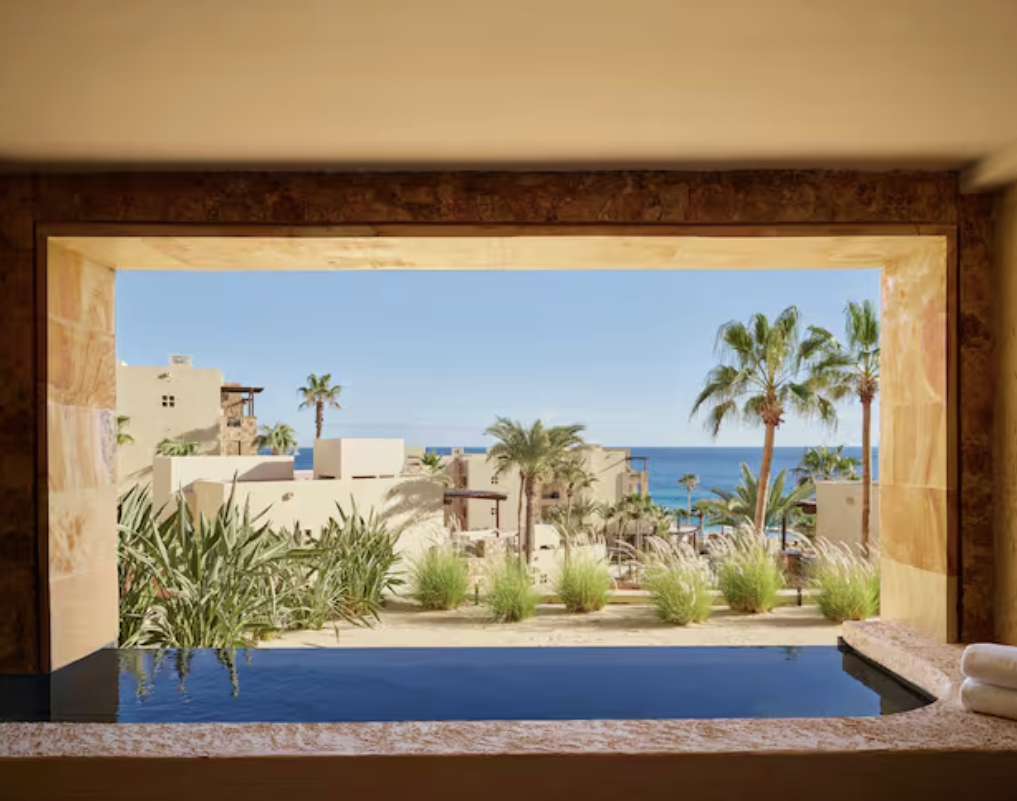 View of the private plunge pool and beach from a King Coastal Room